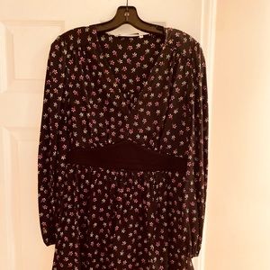 Gorgeous Diane Von Furstenberg dress. Black with delicate flower design. Size 8
